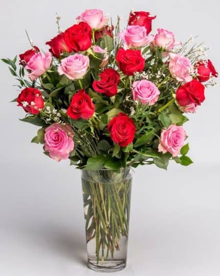Let our designers arrange a stunning mixture of our freshest pink and red roses gathered in our classic tall glass vase.