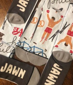 white and grey sock with philly graphics